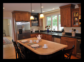 Renovated kitchen with custom island and stainless steel appliances  for residence in Louisa County, Virginia, designed by Candace M.P. Smith Architect