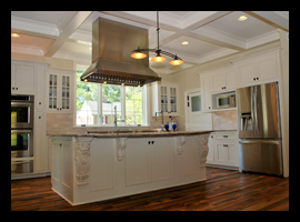 Custom kitchen with coffered ceiling, antique flooring and large custom island for residence in Charlottesville, Virginia, designed by Candace M.P. Smith Architect