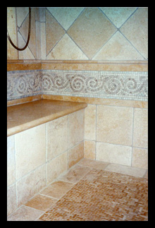 Custom shower with mosaic jerusalem limestone, bench and steam enclosure designed for home in Charlottesville, Virginia, by Candace Smith, AIA