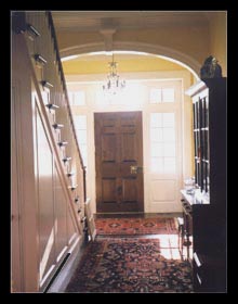 New stair paneling arched opening and entryway designed for new house in Virginia by architect, Candace Smith, AIA
